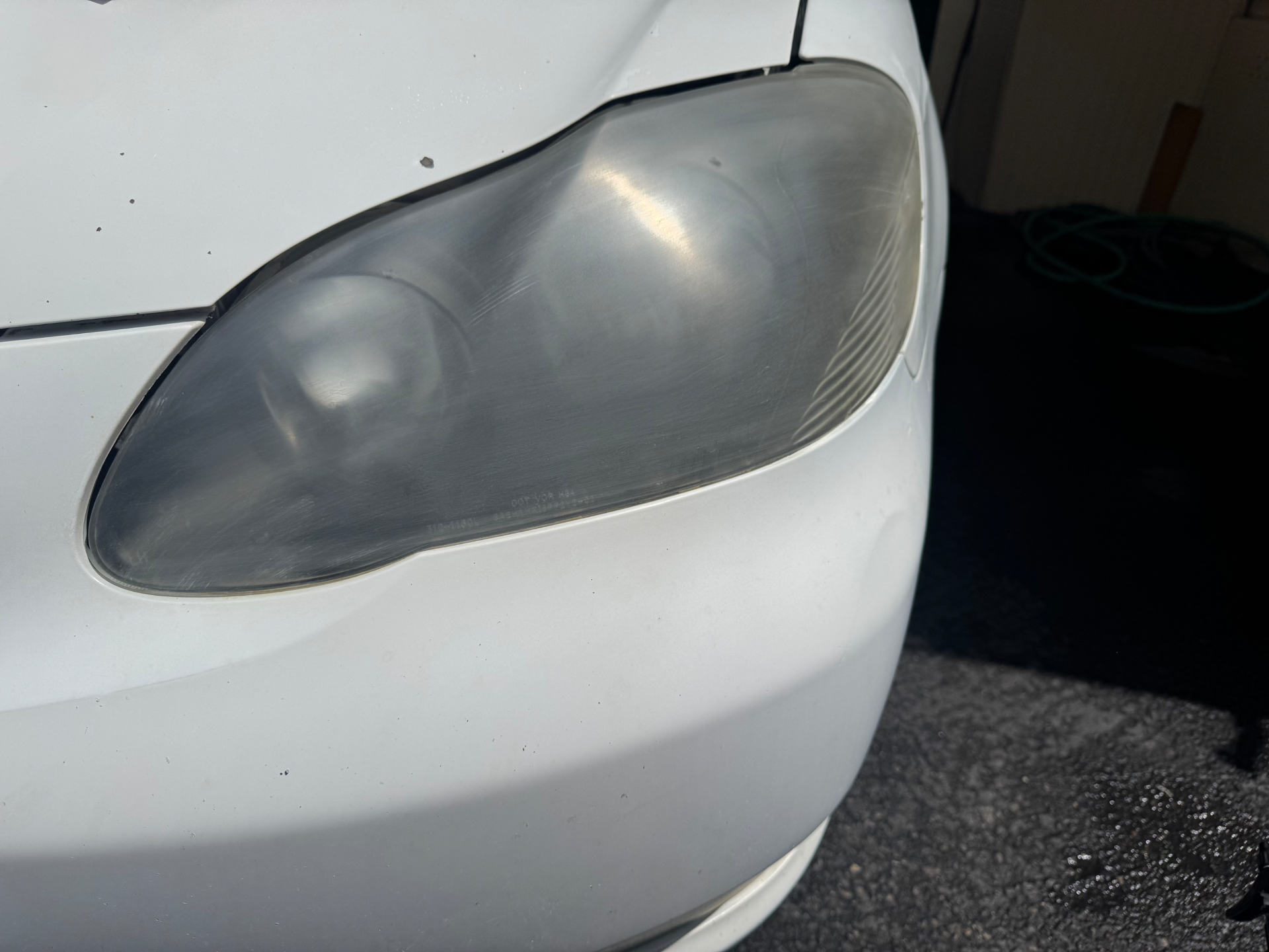 Headlight Restoration — before detailing, showing dirt and wear