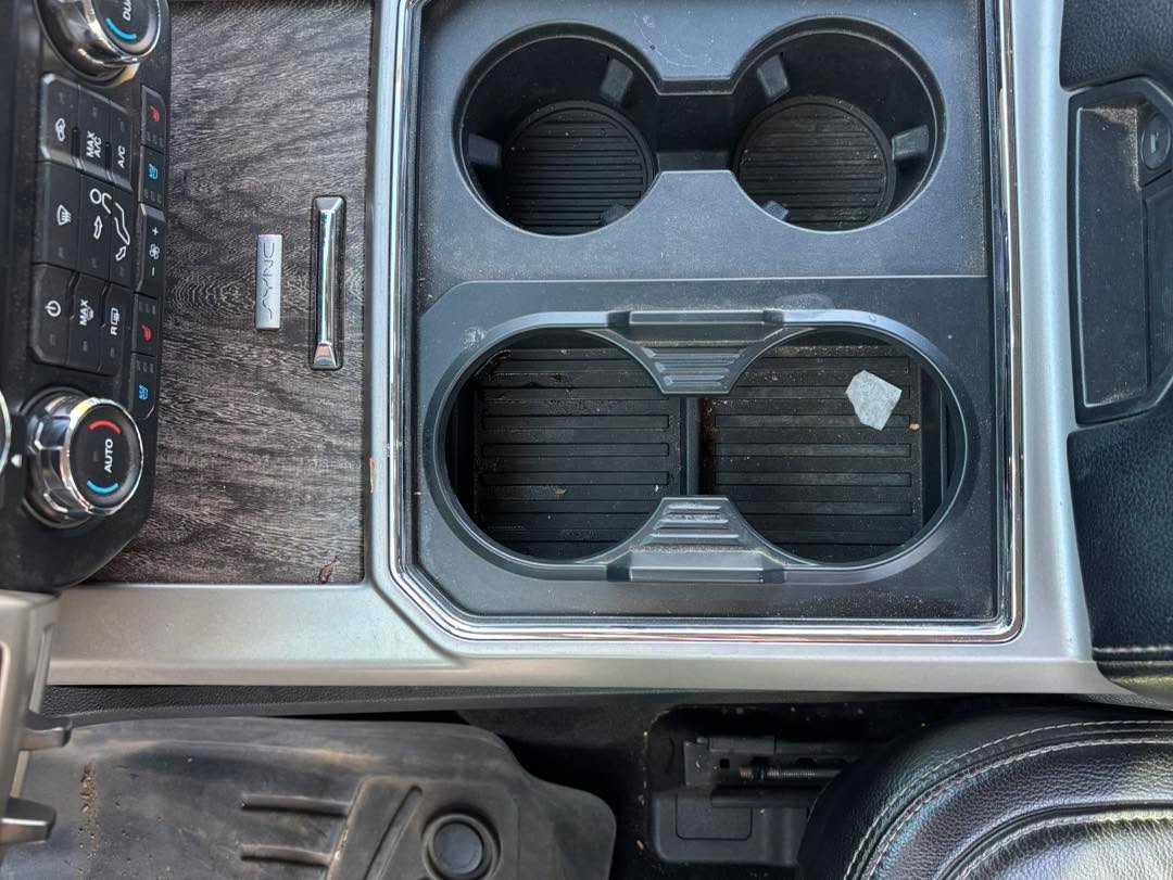 Center Console Detail — before detailing, showing dirt and wear